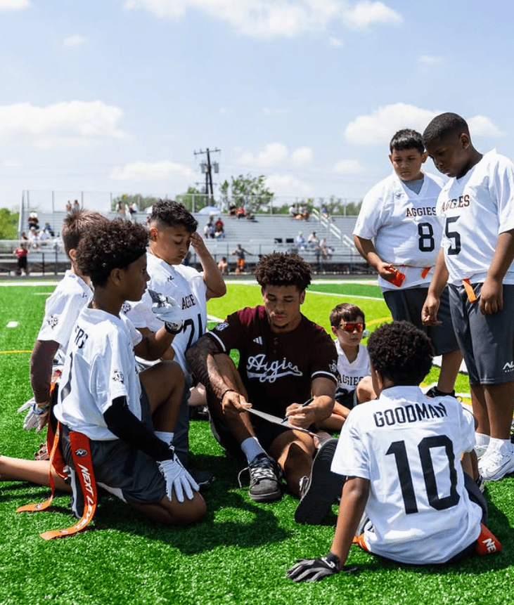 Iowa coach with young athletes
